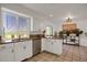 Kitchen area with granite countertops, stainless steel appliances, and breakfast bar seating at 18553 County Road 5, Berthoud, CO 80513
