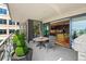 A relaxing outdoor balcony featuring dining area and access to indoor kitchen, perfect for entertaining guests at 155 Steele St # 418, Denver, CO 80206