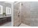 A modern bathroom features a glass shower and a double vanity at 155 Steele St # 418, Denver, CO 80206