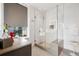 Modern bathroom showcasing a glass-enclosed shower, contemporary fixtures, and natural light at 155 Steele St # 418, Denver, CO 80206