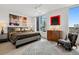 Bedroom featuring an area rug, contemporary decor, and large windows with views at 155 Steele St # 418, Denver, CO 80206