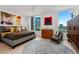 Modern bedroom featuring city views, contemporary art, hardwood floors, and natural light throughout at 155 Steele St # 418, Denver, CO 80206