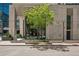 Contemporary building entrance with clean lines, mature tree and refined landscaping at 155 Steele St # 418, Denver, CO 80206