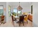 Sunlit dining area with modern lighting fixture, providing natural lighting and ambiance at 155 Steele St # 418, Denver, CO 80206