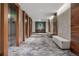 Hallway with elevators and seating, creating an inviting space for residents at 155 Steele St # 418, Denver, CO 80206
