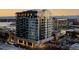 A multi-story building showcasing contemporary architecture, with a mix of dark and light facade elements at 155 Steele St # 418, Denver, CO 80206