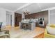 Spacious kitchen with a wine cooler, stainless steel appliances, island with stool seating, and hardwood floors at 155 Steele St # 418, Denver, CO 80206