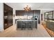 Modern kitchen with island and stainless steel appliances at 155 Steele St # 418, Denver, CO 80206