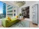 Bright living room featuring city views and an artistic chandelier at 155 Steele St # 418, Denver, CO 80206