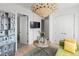 Stylish living room features an artistic chandelier, with modern decor at 155 Steele St # 418, Denver, CO 80206