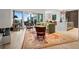 Spacious living room with modern fireplace, rug, and balcony access at 155 Steele St # 418, Denver, CO 80206