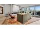Cozy living room featuring modern fireplace and balcony access at 155 Steele St # 418, Denver, CO 80206