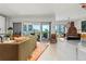 Bright open concept living room with stylish furnishings and a view of the balcony at 155 Steele St # 418, Denver, CO 80206