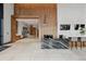 Open concept lobby with a wood paneled accent wall and black marble front desk at 155 Steele St # 418, Denver, CO 80206