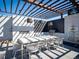 Inviting outdoor kitchen featuring a shaded dining area and built-in grill, perfect for entertaining at 155 Steele St # 418, Denver, CO 80206