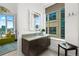 A powder room features a modern vanity and city views at 155 Steele St # 418, Denver, CO 80206