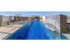 Beautiful rooftop pool with waterfall feature, providing a serene escape at 155 Steele St # 418, Denver, CO 80206