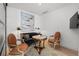 Cozy sitting area with a decorative chairs, marble table, velvet couch, modern art, and ample lighting at 155 Steele St # 418, Denver, CO 80206