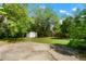 Backyard with mature tree and storage shed at 5455 Dudley Ct, Arvada, CO 80002