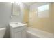 Full bathroom with a single vanity, tub, and shower at 5455 Dudley Ct, Arvada, CO 80002