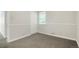 Bedroom featuring gray carpet, base molding and natural light at 5455 Dudley Ct, Arvada, CO 80002