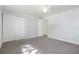 Bedroom featuring large closets and a light gray carpet at 5455 Dudley Ct, Arvada, CO 80002