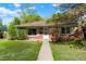 Charming brick home with a well-maintained lawn and inviting front entrance at 5455 Dudley Ct, Arvada, CO 80002