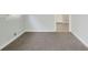 Neutral carpeted room with crisp white trim, creating a bright and clean space at 5455 Dudley Ct, Arvada, CO 80002
