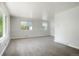 Bright living room with neutral walls, plush carpet, and ample natural light at 5455 Dudley Ct, Arvada, CO 80002