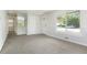 Inviting living room featuring a large window, neutral walls, and plush carpet at 5455 Dudley Ct, Arvada, CO 80002
