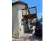 Home's exterior with elevated deck and gravel driveway at 253 N Lincoln St, Denver, CO 80203