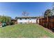 Backyard featuring green grass and a wooden fence at 8540 Corona St, Denver, CO 80229