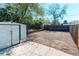 View of the home's backyard featuring a storage shed, gravel bed and a wood fence at 8540 Corona St, Denver, CO 80229