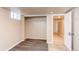 Basement bedroom with carpet, closet and open doorway at 8540 Corona St, Denver, CO 80229