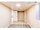 Finished basement room featuring tile flooring, a closet, a bright window, and door to bedroom at 8540 Corona St, Denver, CO 80229