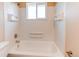 Clean bathroom with built in shelving at 8540 Corona St, Denver, CO 80229
