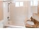 Bathroom featuring white shower-tub, granite vanity, and toilet at 8540 Corona St, Denver, CO 80229