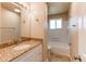 Updated bathroom with vanity and bathtub at 8540 Corona St, Denver, CO 80229