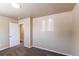 Spacious bedroom with plush carpet flooring and a walk in closet at 8540 Corona St, Denver, CO 80229