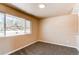 Bright bedroom with large window and neutral carpeting, offering a cozy atmosphere and natural light at 8540 Corona St, Denver, CO 80229