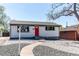 Charming home with a freshly painted exterior, red front door, and updated landscaping at 8540 Corona St, Denver, CO 80229