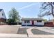 Inviting single-story home with fresh exterior paint, manicured landscaping, and a stone walkway at 8540 Corona St, Denver, CO 80229