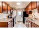Updated kitchen features granite countertops, sleek appliances, and a functional layout for cooking at 8540 Corona St, Denver, CO 80229