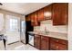 Well-appointed kitchen features stainless steel appliances, granite countertops, and ample cabinet space at 8540 Corona St, Denver, CO 80229