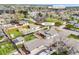 Aerial view of a home at 1055 Quartz St, revealing lush greenery and nearby South Table Mountain at 1055 Quartz St, Golden, CO 80401