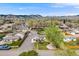 Expansive aerial view showcases a charming neighborhood nestled against a stunning mountain backdrop at 1055 Quartz St, Golden, CO 80401