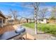 Well-maintained backyard with lush grass, and mature trees at 1055 Quartz St, Golden, CO 80401