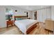 Comfortable bedroom featuring hardwood floors, a ceiling fan, and ample natural light at 1055 Quartz St, Golden, CO 80401
