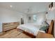 A bright and spacious bedroom with a ceiling fan, hardwood floors, and a window at 1055 Quartz St, Golden, CO 80401
