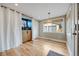 Bright dining area with hardwood floors, large window, and stylish pendant lighting at 1055 Quartz St, Golden, CO 80401